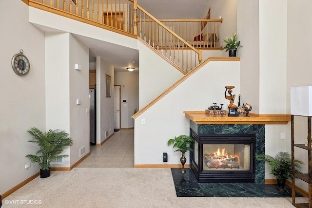 711 Creekside Cir Unit 711, Gurnee, IL 60031 - carpeted living area featuring stairs and a fireplace