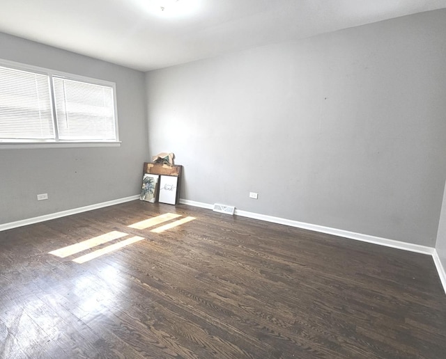 678 Muskegon Ave, Calumet City, IL 60409 - empty room featuring wood finished floors and baseboards