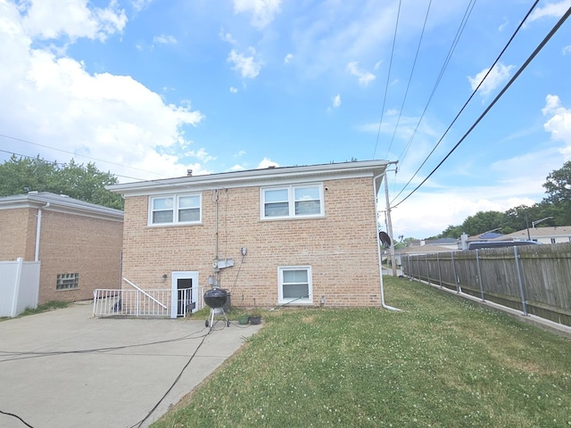 678 Muskegon Ave, Calumet City, IL 60409 - back of property featuring brick siding and a patio
