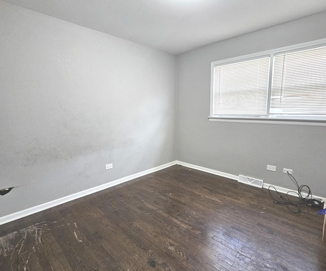 678 Muskegon Ave, Calumet City, IL 60409 - empty room with wood finished floors and baseboards