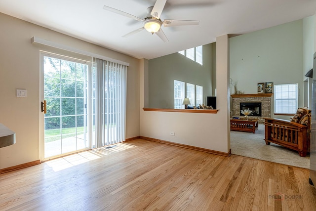330 Greenview Ln, Lake Villa, IL 60046 - unfurnished living room featuring ceiling fan, wood finished floors, and a fireplace