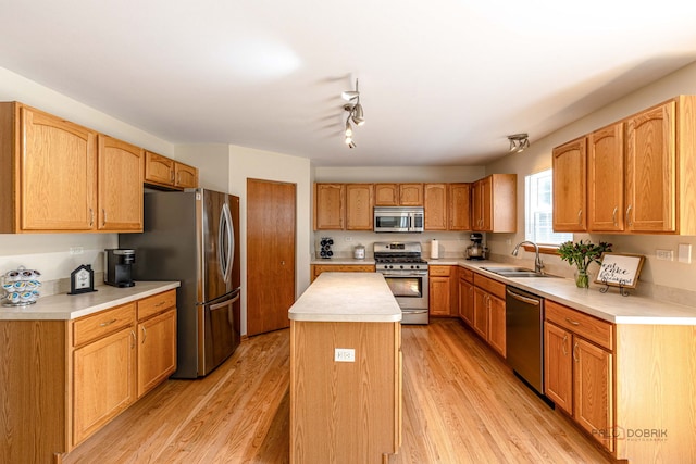 330 Greenview Ln, Lake Villa, IL 60046 - kitchen featuring stainless steel appliances, a kitchen island, light countertops, and light wood-style flooring