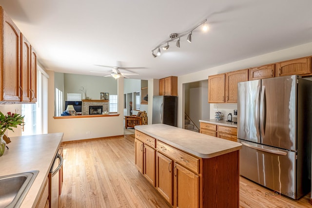 330 Greenview Ln, Lake Villa, IL 60046 - kitchen with appliances with stainless steel finishes, light countertops, light wood-type flooring, and a center island