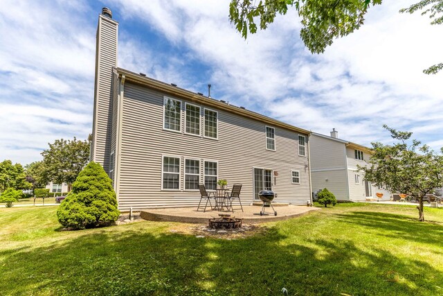 330 Greenview Ln, Lake Villa, IL 60046 - back of house featuring a chimney, a patio area, and a yard