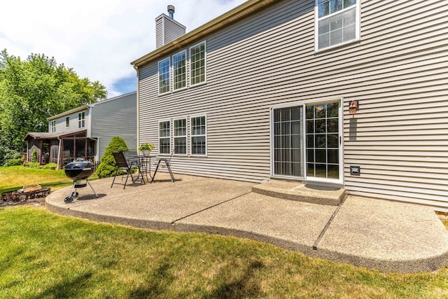 330 Greenview Ln, Lake Villa, IL 60046 - rear view of house featuring a patio area, a lawn, and a chimney