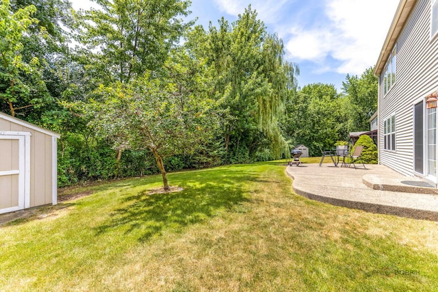 330 Greenview Ln, Lake Villa, IL 60046 - view of green lawn featuring a storage shed, a patio, and view of wooded area