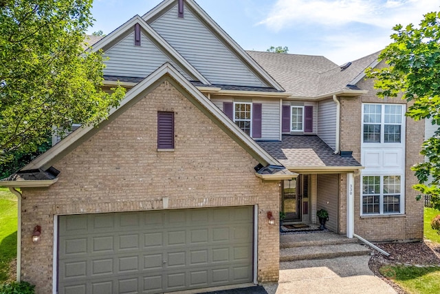 330 Greenview Ln, Lake Villa, IL 60046 - traditional-style house featuring brick siding, roof with shingles, and driveway
