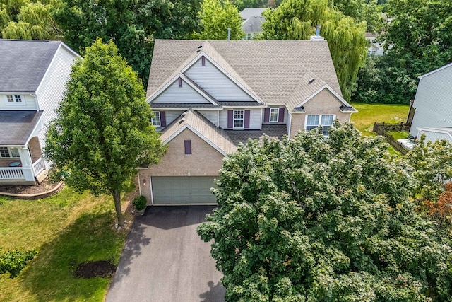 330 Greenview Ln, Lake Villa, IL 60046 - view of front of house with driveway, a garage, roof with shingles, and a front lawn