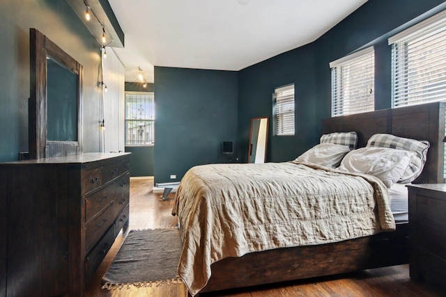700 W Cornelia Ave Unit 3E, Chicago, IL 60657 - bedroom featuring wood finished floors and track lighting