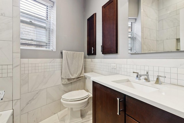 700 W Cornelia Ave Unit 3E, Chicago, IL 60657 - bathroom with tile walls, vanity, and healthy amount of natural light