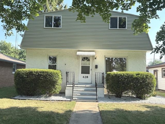 428 W Williams St, Kankakee, IL 60901 - view of front of property featuring stucco siding and a front yard