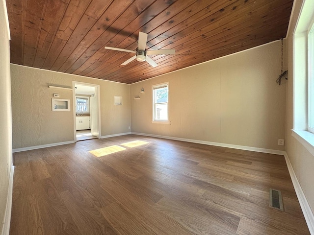 428 W Williams St, Kankakee, IL 60901 - spare room with wood ceiling, plenty of natural light, ceiling fan, wood finished floors, and a textured wall