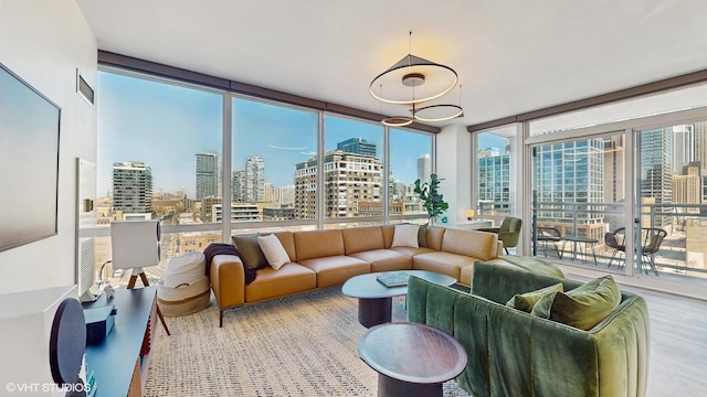 757 N Orleans St Unit 907, Chicago, IL 60654 - living room with a skyline view, floor to ceiling windows, and wood finished floors