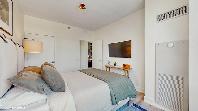 757 N Orleans St Unit 907, Chicago, IL 60654 - bedroom with wood finished floors and baseboards