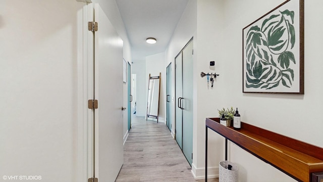 757 N Orleans St Unit 907, Chicago, IL 60654 - hallway with light wood finished floors and baseboards