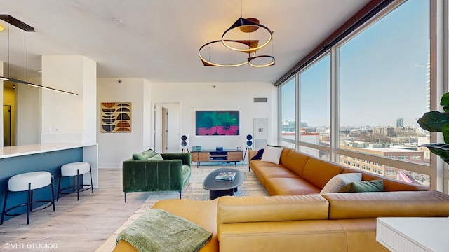 757 N Orleans St Unit 907, Chicago, IL 60654 - living room featuring light wood finished floors, healthy amount of natural light, and a city view