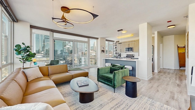 757 N Orleans St Unit 907, Chicago, IL 60654 - living room with light wood finished floors and healthy amount of natural light