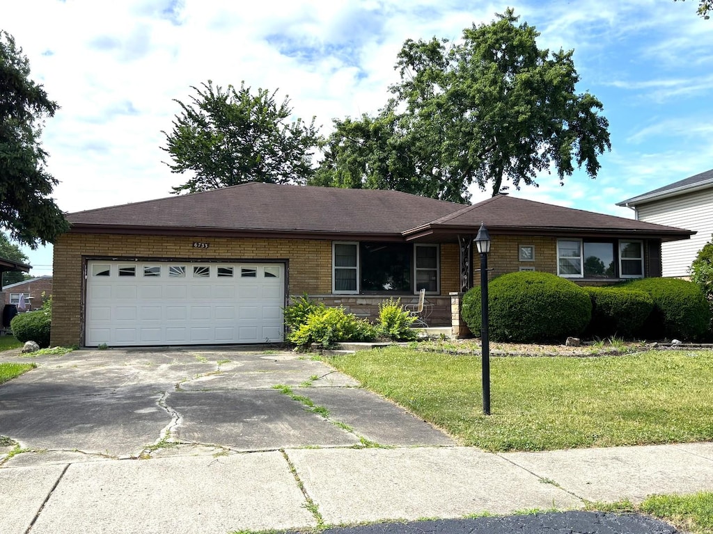 6733 W 88th St, Oak Lawn, IL 60453 - ranch-style home featuring concrete driveway, a front yard, a garage, and brick siding