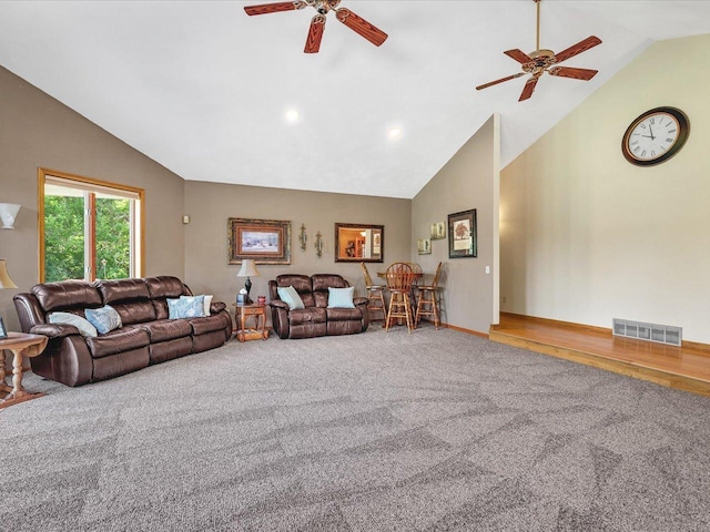 12828 Menominee Trl, Roscoe, IL 61073 - carpeted living room with a ceiling fan and high vaulted ceiling