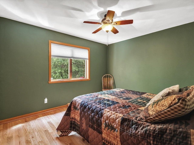12828 Menominee Trl, Roscoe, IL 61073 - bedroom featuring wood finished floors and a ceiling fan