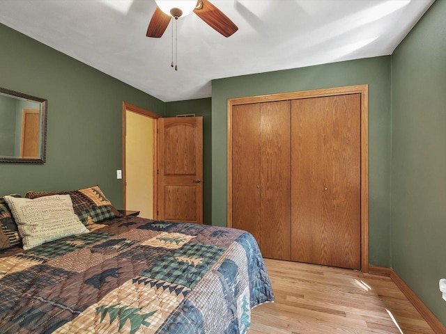 12828 Menominee Trl, Roscoe, IL 61073 - bedroom featuring light wood-type flooring, a closet, and a ceiling fan