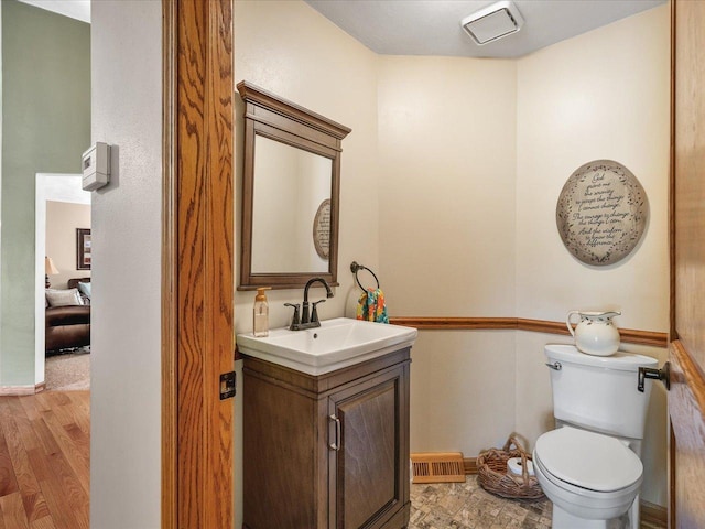 12828 Menominee Trl, Roscoe, IL 61073 - half bath with vanity and wood finished floors