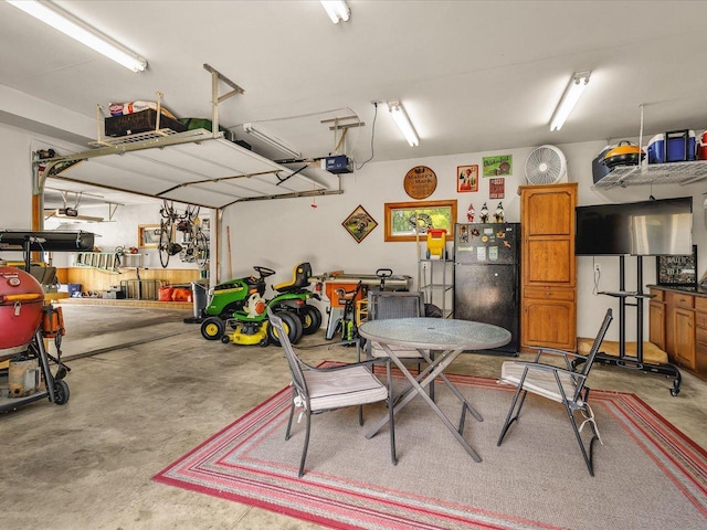 12828 Menominee Trl, Roscoe, IL 61073 - garage with freestanding refrigerator and a garage door opener