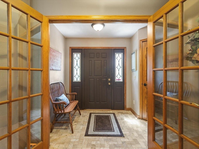 12828 Menominee Trl, Roscoe, IL 61073 - entryway featuring brick patterned floors and french doors
