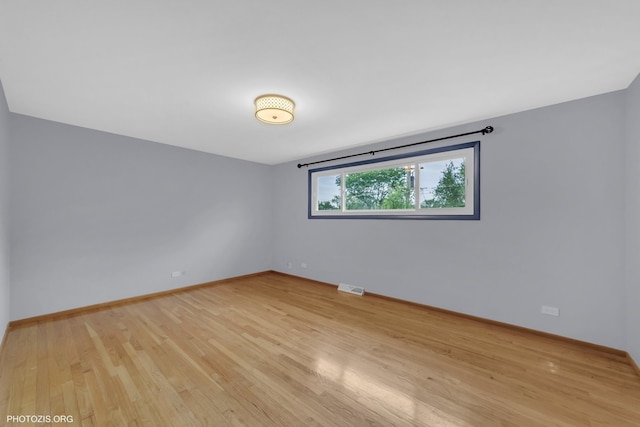 445 Kinkaid Ct, Des Plaines, IL 60016 - unfurnished room with light wood finished floors and baseboards