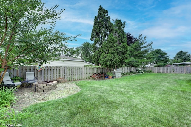 445 Kinkaid Ct, Des Plaines, IL 60016 - fenced backyard with a fire pit