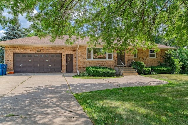 1481 Bloomingdale Rd, Glendale Heights, IL 60139 - view of front facade with driveway, brick siding, a front lawn, an attached garage, and roof with shingles