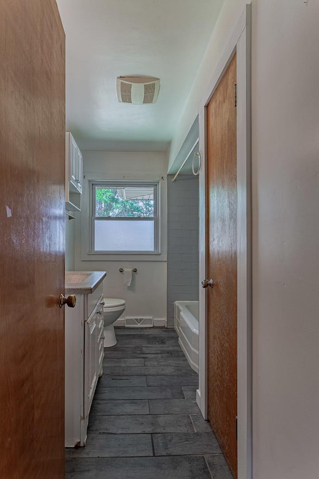 1481 Bloomingdale Rd, Glendale Heights, IL 60139 - bathroom with vanity, wood finished floors, and washtub / shower combination