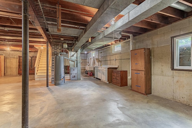 1481 Bloomingdale Rd, Glendale Heights, IL 60139 - below grade area with gas water heater, heating unit, stairs, and plenty of natural light