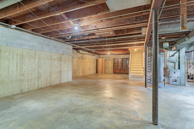 1481 Bloomingdale Rd, Glendale Heights, IL 60139 - unfinished below grade area featuring stairway, heating unit, and gas water heater