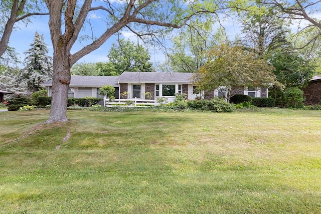 1485 Bryn Mawr Ln, Rockford, IL 61107 - ranch-style home featuring a front yard and brick siding
