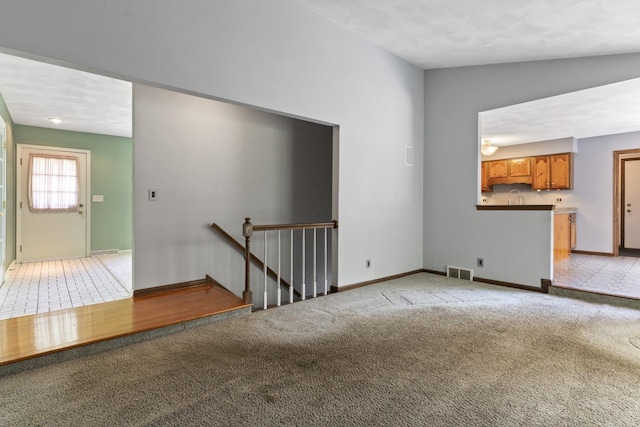 1485 Bryn Mawr Ln, Rockford, IL 61107 - unfurnished living room with light colored carpet and baseboards