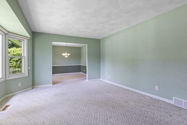 1485 Bryn Mawr Ln, Rockford, IL 61107 - unfurnished room featuring a chandelier and carpet