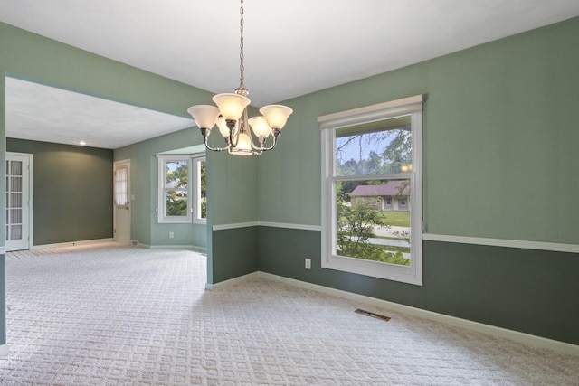 1485 Bryn Mawr Ln, Rockford, IL 61107 - carpeted spare room featuring a chandelier and baseboards