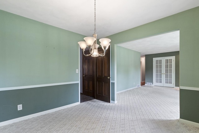 1485 Bryn Mawr Ln, Rockford, IL 61107 - unfurnished room featuring a chandelier, carpet, and french doors