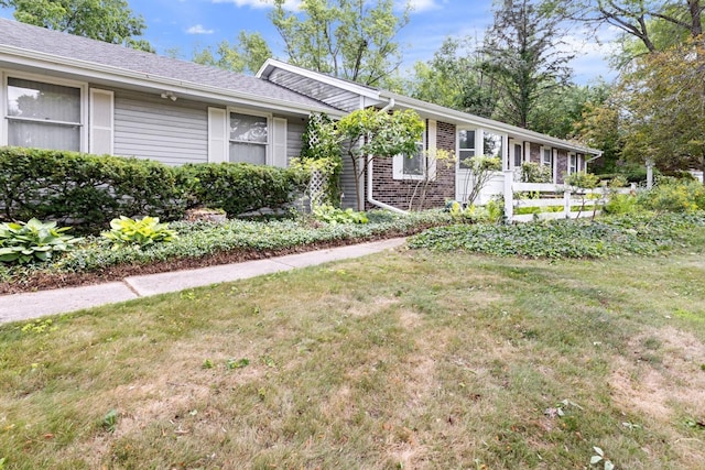 1485 Bryn Mawr Ln, Rockford, IL 61107 - ranch-style home with a front yard and brick siding