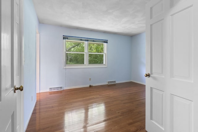 1485 Bryn Mawr Ln, Rockford, IL 61107 - unfurnished bedroom with hardwood / wood-style flooring and baseboards
