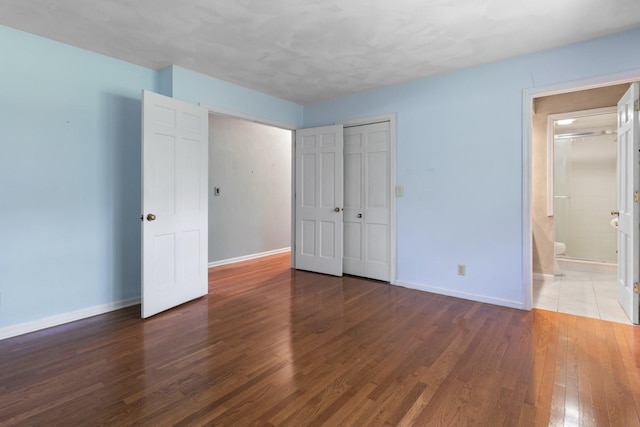 1485 Bryn Mawr Ln, Rockford, IL 61107 - unfurnished bedroom with wood finished floors, a closet, and ensuite bathroom