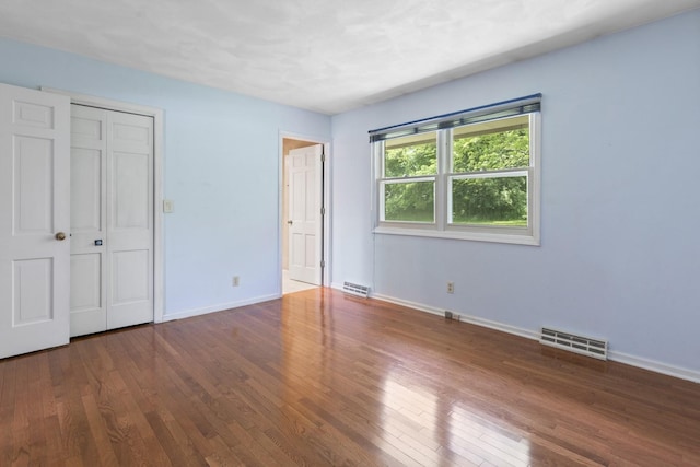 1485 Bryn Mawr Ln, Rockford, IL 61107 - unfurnished bedroom featuring hardwood / wood-style floors and a closet