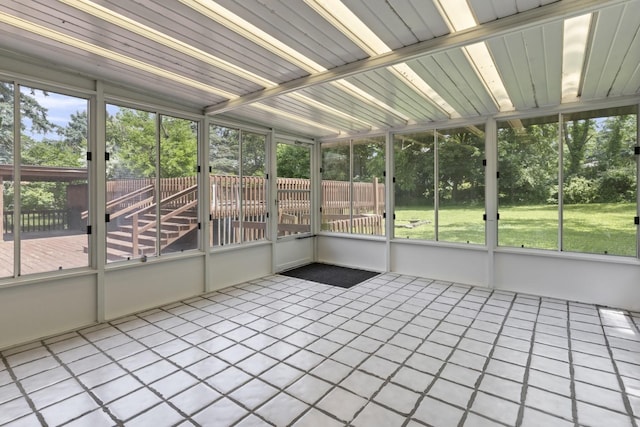 1485 Bryn Mawr Ln, Rockford, IL 61107 - unfurnished sunroom featuring view of wooded area