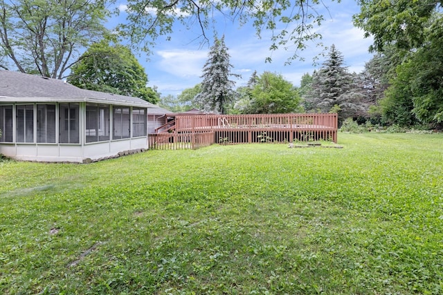 1485 Bryn Mawr Ln, Rockford, IL 61107 - view of grassy yard with a sunroom and a deck