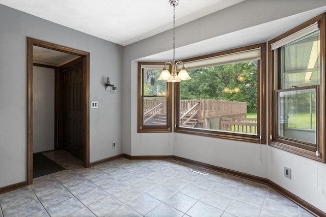 1485 Bryn Mawr Ln, Rockford, IL 61107 - unfurnished dining area featuring a chandelier and light tile patterned floors