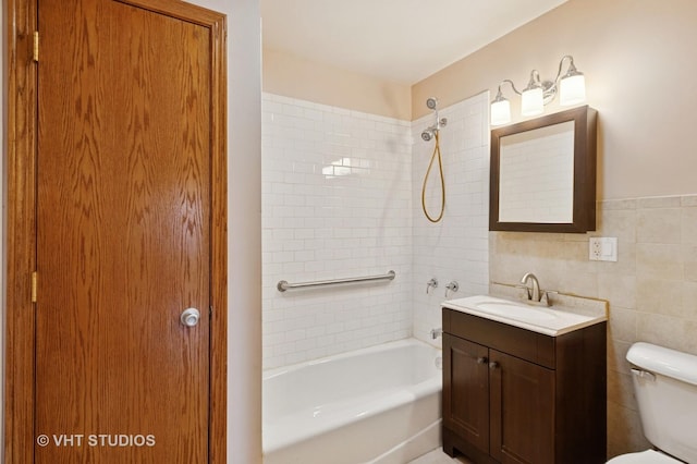 7241 N Mcvicker Ave, Chicago, IL 60646 - bathroom with bathing tub / shower combination, vanity, and tile walls
