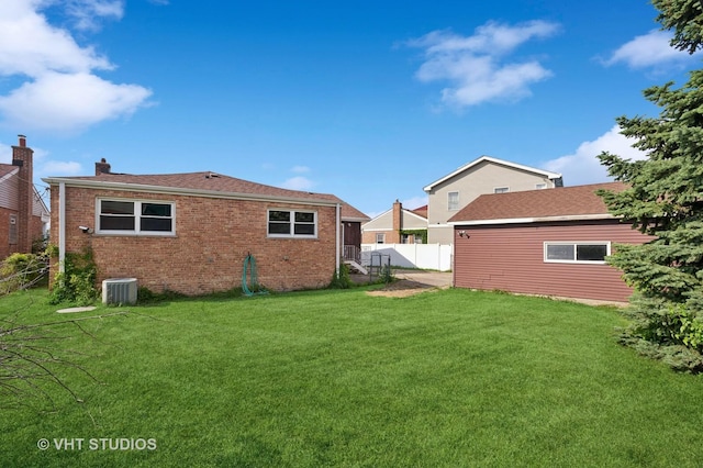 7241 N Mcvicker Ave, Chicago, IL 60646 - back of property with a chimney and brick siding