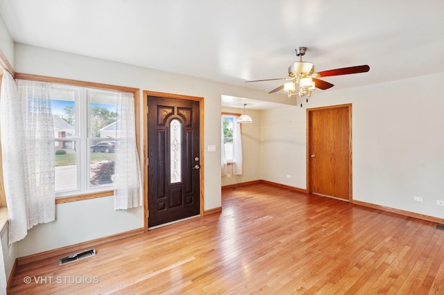 7241 N Mcvicker Ave, Chicago, IL 60646 - entrance foyer featuring light wood-style flooring and a ceiling fan