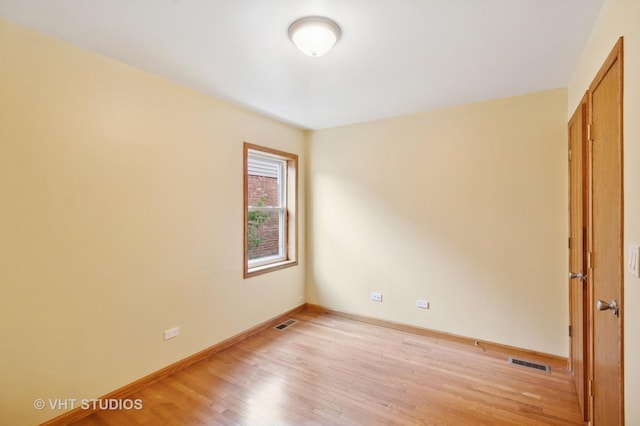 7241 N Mcvicker Ave, Chicago, IL 60646 - spare room with light wood-style floors and baseboards